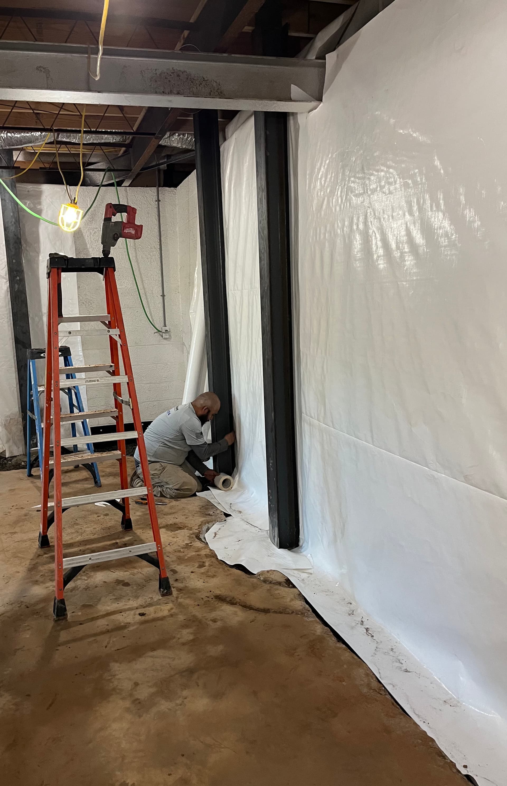 Steel I-Beam Installation Stopping Bowing Basement Walls in North Georgia image